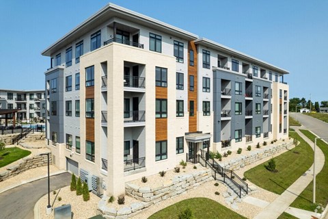 an exterior view of a building with a staircase in front of it